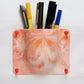 front view of wall mounted holder made from recycled plastic durable eco friendly storage solution for homes and offices